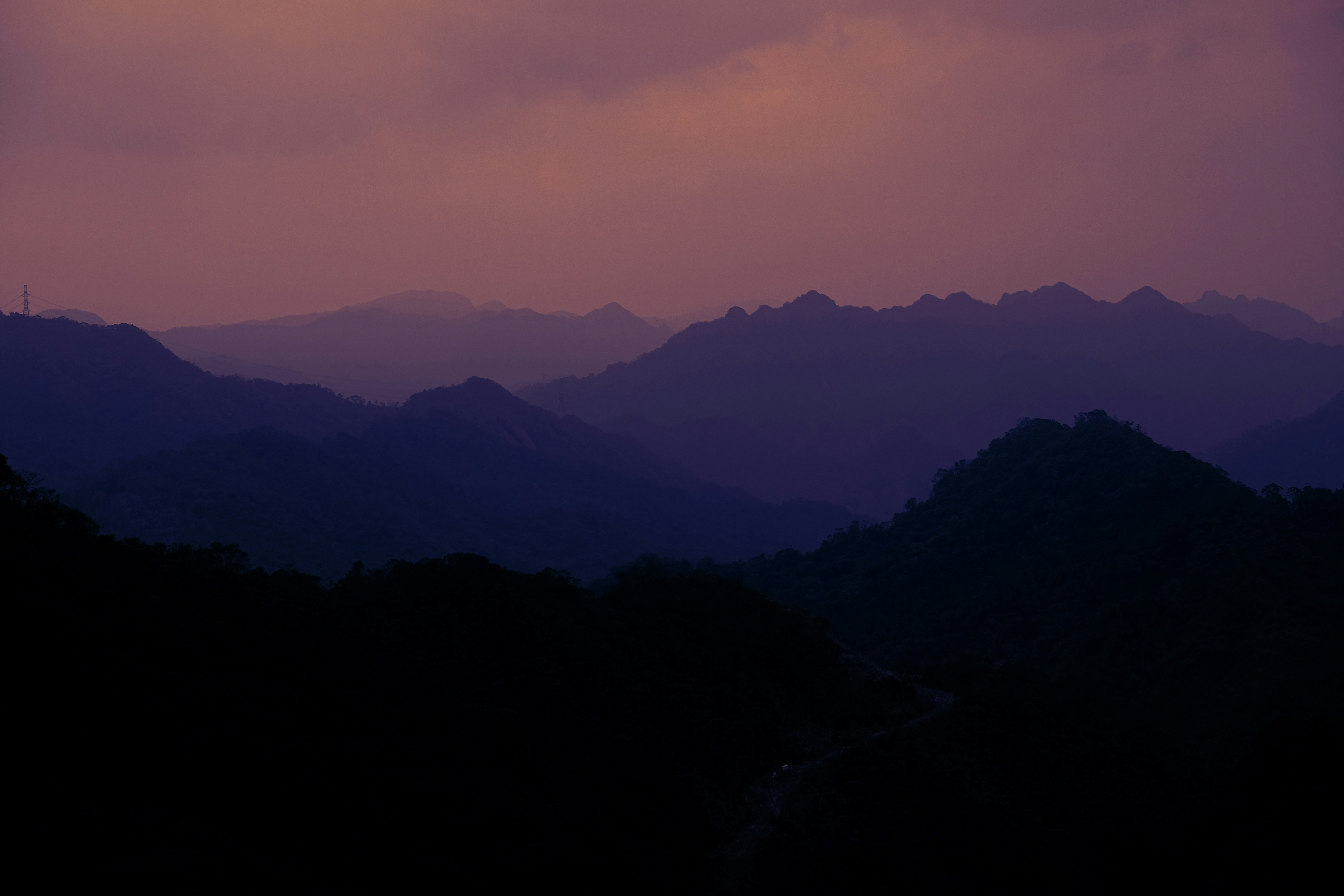 silhouette of mountains during sunset